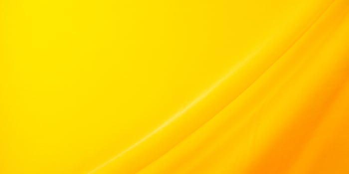 abstract yellow fabric background with waves photo