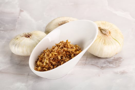 Dried roasted onion flakes for culinary photo