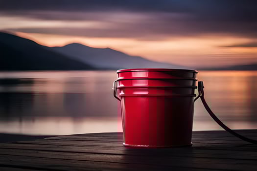 a red bucket sits on a dock at sunset. AI-Generated photo