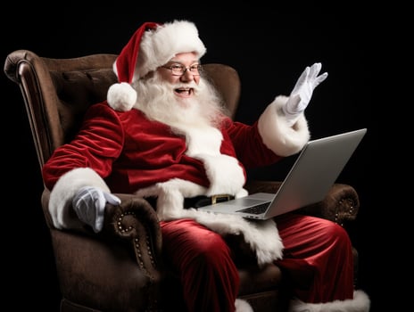 AI Generated AI generation. Santa Claus using a laptop computer. Sitting in a chair on the eve of photo