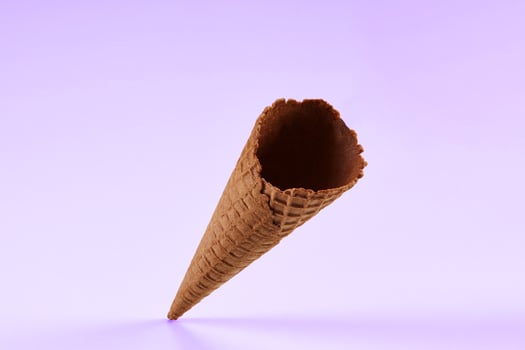 Empty, delicious, chocolate wafer cone for ice cream isolated on white. Concept of food, treats. Mockup, template for advertising and design. Close up photo