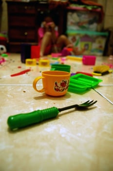 Scattered plastic toys of a little girl photo