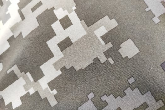 Texture close-up pixel camouflage military uniform of the Armed Forces photo