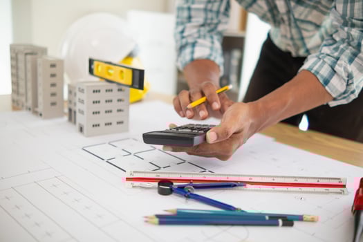 Construction engineers are checking blueprints and calculating their accuracy after receiving plans from architect in order start  construction safely. Inspection Concept from construction engineering photo