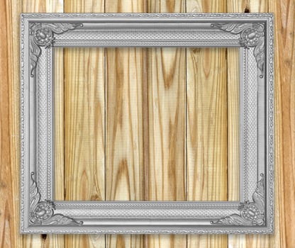 Antique gray frame on wooden wall Empty picture frame on white wooden wall. photo