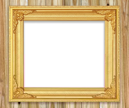 Antique gold frame on white wooden wall.Empty picture frame on white wooden wall. photo