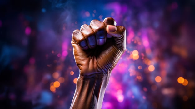 The idea of solidarity, a woman's hand clenched into a fist raised up, the fight for women's rights photo