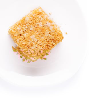 Slice of Napoleon Cake on top view photo