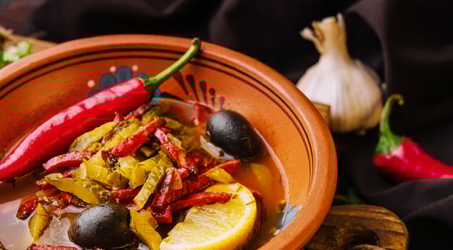 Meat Solyanka soup on a wooden board photo
