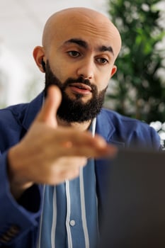 Project manager discussing product launch strategy with team in videocall using video conference software on laptop. Company financial analyst explaining report in online meeting photo