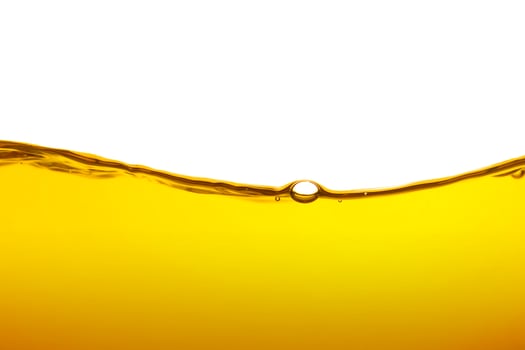 Oil wave background, yellow liquid, on white background. photo
