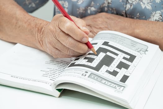 Bangkok, Thailand June 14, 2023 Alzheimer disease AD, Asian elderly woman playing sudoku puzzle game to practice for dementia prevention. photo