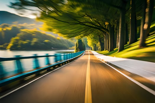 a blurry image of a road with trees and water. AI-Generated photo