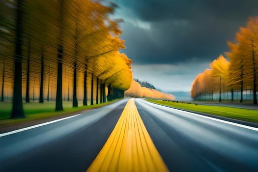 a blurry image of a road with yellow trees. AI-Generated photo