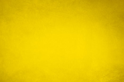 golden velvet fabric texture used as background. blond color panne fabric background of soft and smooth textile material. crushed velvet .luxury yellow tone for silk.. photo