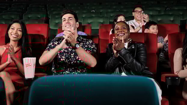 Various people in theater. Multiracial audiences, Black woman, and friends enjoy watching cinema and applauding together on movie shows, entertainment lifestyle with film, happy and cheerful smiles. photo