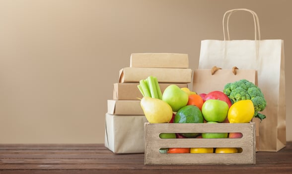Box with food and paper packaging. Delivery concept. photo