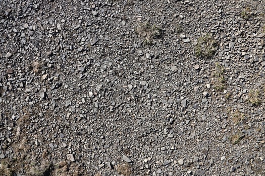 Background of shattered stony stones surface in mountain area. Texture with natural light photo