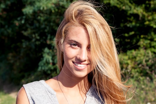 portrait of smiling beautiful young woman outdoor on vacation photo