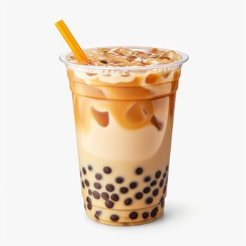 Light brown creamy bubble tea with milk and black tapioca with a green straw in a transparent cup isolated on white. Generative ai photo