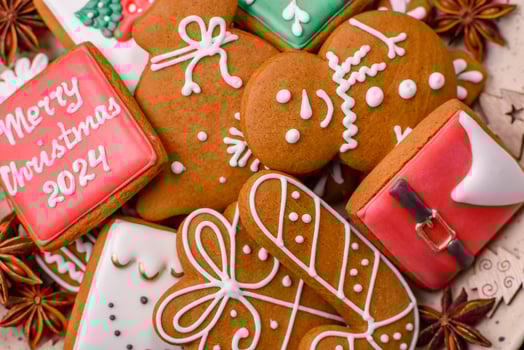 Beautiful Christmas gingerbread cookies of different colors on a ceramic plate photo