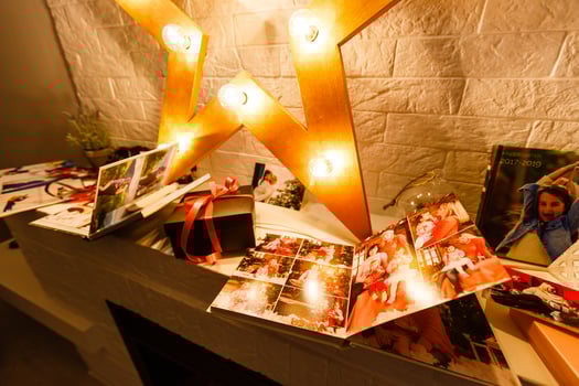 book together near Christmas tree in front of fireplace photo