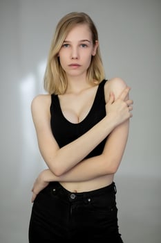 Portrait of a casual blonde woman in black top photo
