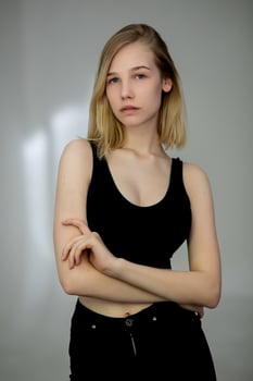 Portrait of a casual blonde woman in black top photo