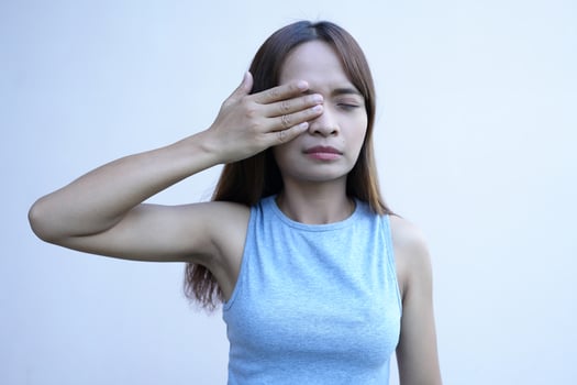 Asian woman has eye pain photo