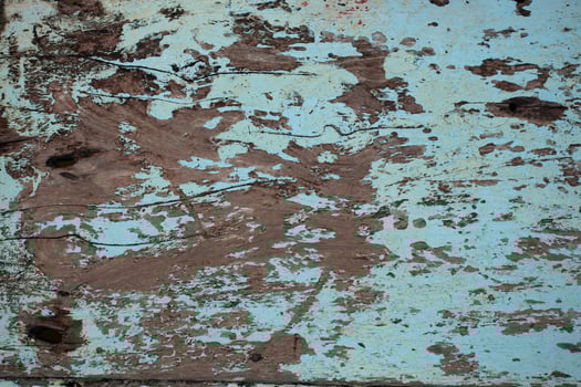 Old wooden walls with cracked and peeling paint photo