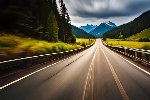 a blurry image of a road with mountains in the background. AI-Generated photo