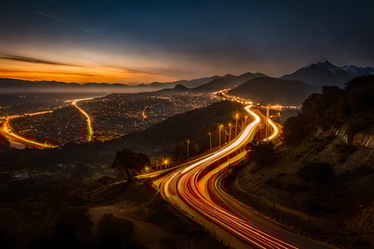 a long exposure photograph of a city at night with lights on the road. AI-Generated photo