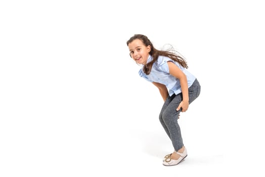 little girl jumps on a white background photo