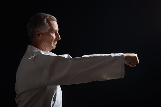 Senior man practicing karate photo