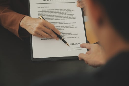 Business and lawyers discussing contract papers with brass scale on desk in office. Law, legal services, advice, justice and law concept picture with film grain effect photo