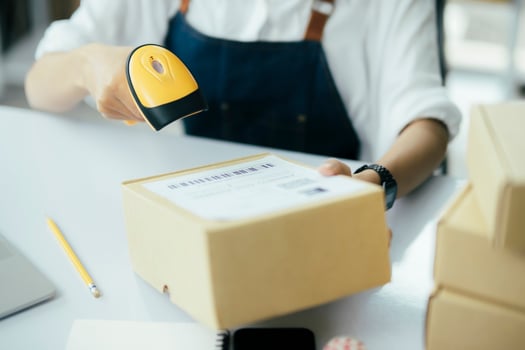 Scanning parcel barcode before shipment photo