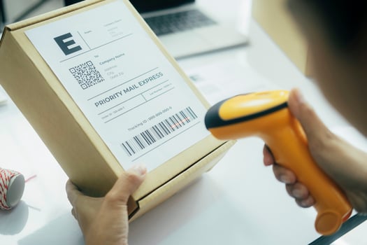 Scanning parcel barcode before shipment. photo