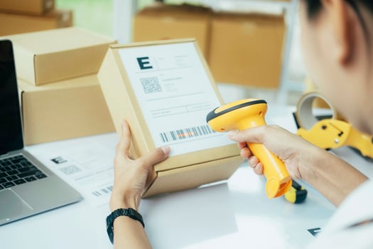 Scanning parcel barcode before shipment. photo