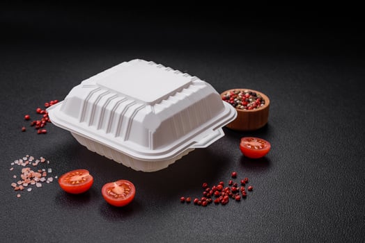Square plastic or cardboard container of white color for food photo