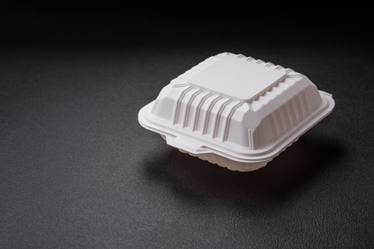 Square plastic or cardboard container of white color for food photo