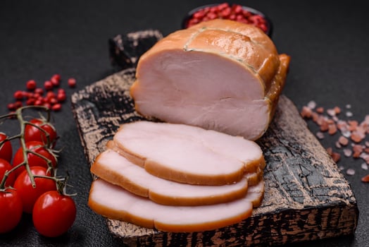 Delicious smoked pork or chicken meat with salt, spices and herbs photo