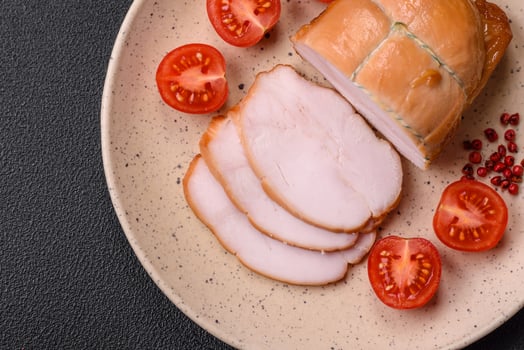 Delicious smoked pork or chicken meat with salt, spices and herbs photo