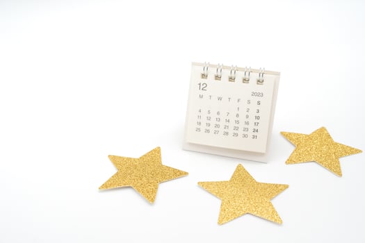 Desk Calendar DEC 2023 and Gold Star isolated on white background. Month planning in the calendar. Christmas background. photo