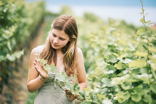 Outdoor portrait of pretty young teenager girl hiking in vineyards, summer activities photo