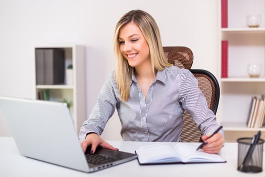 Beautiful businesswoman working at her office photo