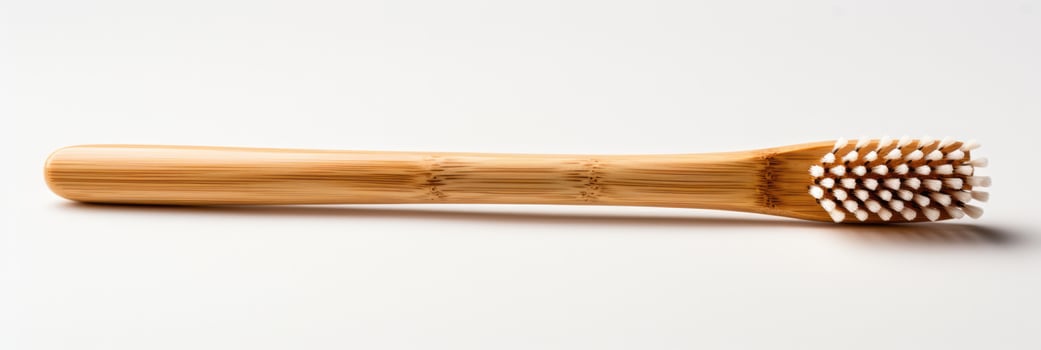 Reusable bamboo toothbrush focusing on sustainable choices isolated on a white background photo