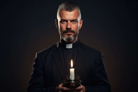 Priest holding Midnight Mass on Christmas Eve isolated on a gradient background photo