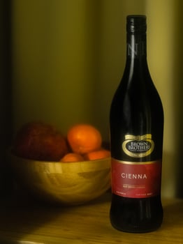 quality still life photo of wine and fruit bowl