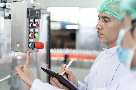 quality supervisor or food or beverages technician change parameter and condition control food or beverages before send product to the customer. Production leader recheck machine and productivity. photo