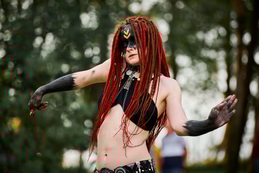 Mythological dancing girl faun on green lawn in public park outdoor art dancing event photo